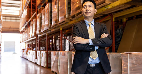 PortraitOfAsianConfidenceBusinessmanInvestorStandInLargeFactory