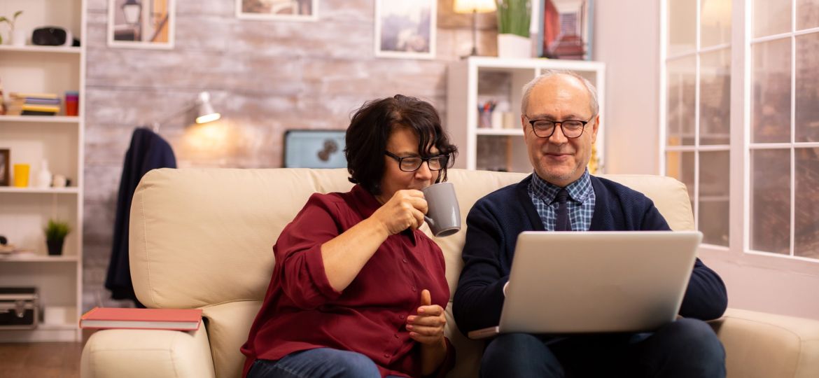 elderly-old-couple-using-modern-laptop-to-chat-wit-2023-11-27-05-13-21-utc-scaled