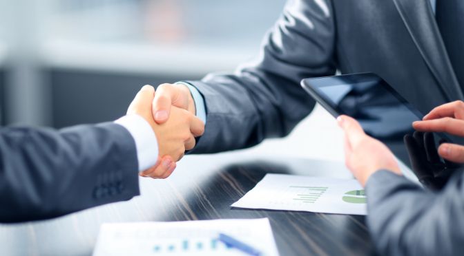 Business people shaking hands in office - KSDT CPA